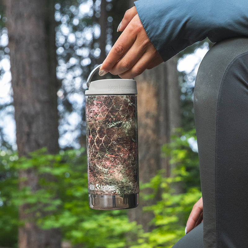 12oz-tkwide-with-twist-cap-mossy-oak-u3 12oz_tumbler_mossyoak_rainbowtrout_hand_closeup_square.jpg
