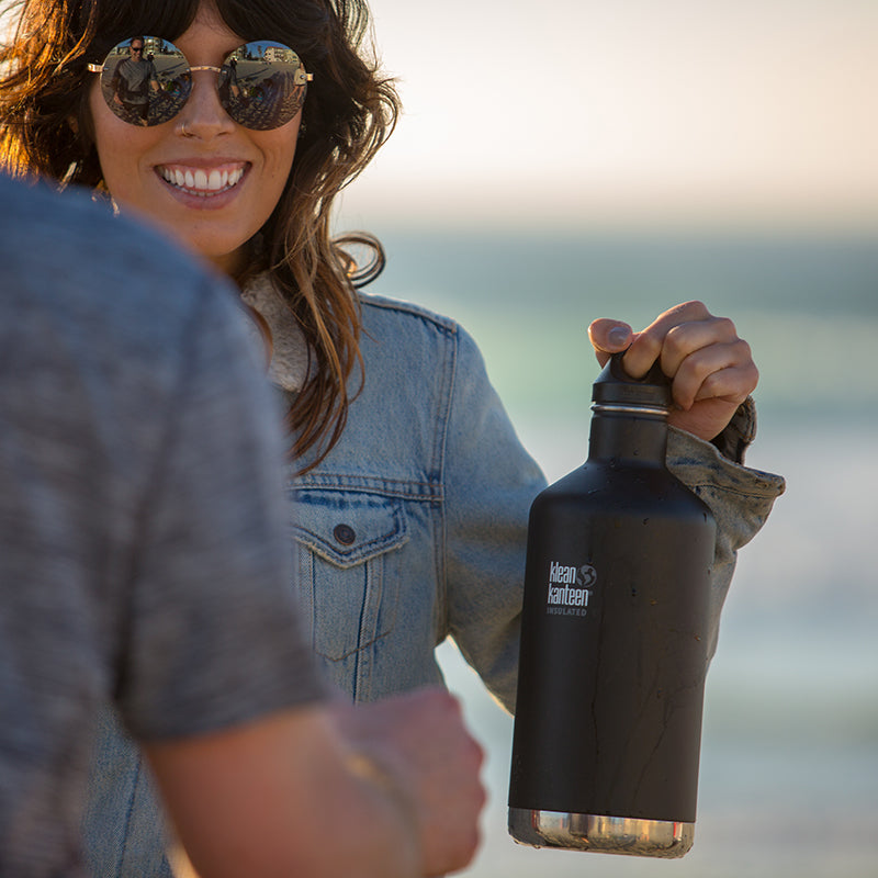 64oz-classic-with-loop-cap-l5 64oz_insulated_classic_black_beach_girl_hand_square.jpg