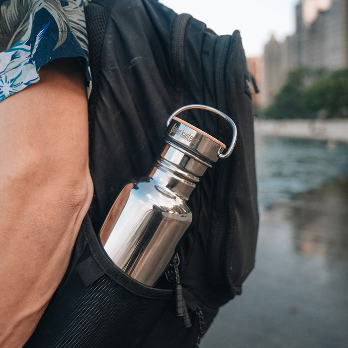 27oz-reflect-with-bamboo-cap-t0 K27SSLRF-MS-BAMBOO_reflect-bottle_backpack_lifestyle.jpg